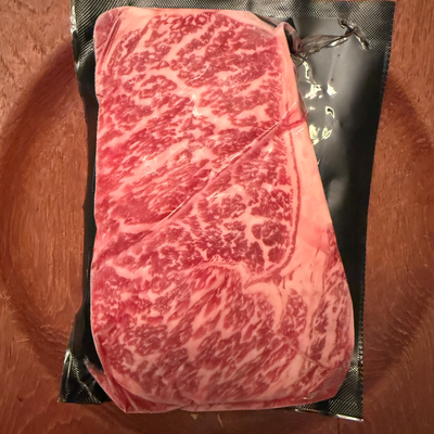 A premium, flash-frozen 100% Fullblood American Wagyu ribeye steak cleanly vacuum-sealed in heavy-duty commercial packaging by Winston Cattle Co.