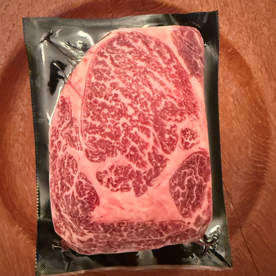 A premium, flash-frozen 100% Fullblood American Wagyu ribeye steak cleanly vacuum-sealed in heavy-duty commercial packaging by Winston Cattle Co.